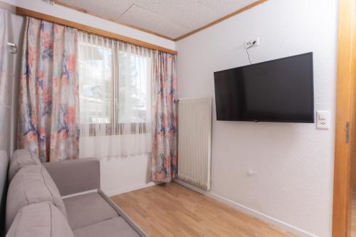Una televisión o centro de entretenimiento en Haus Slalom