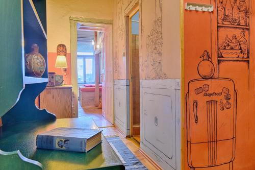a room with a table with a suitcase on it at Lavender Circus Hostel, Doubles & Ensuites in Budapest