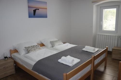Postel nebo postele na pokoji v ubytování Apartmaji ANA