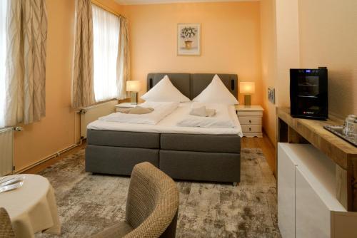Postel nebo postele na pokoji v ubytování Hotel Zur Mühle