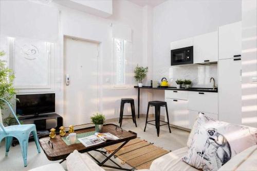Η κουζίνα ή μικρή κουζίνα στο MonKeys Apartments PinoLoft Nuevo Torneo