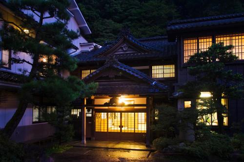 a japanese house at night with lights at Motoyu Ishiya in Kanazawa