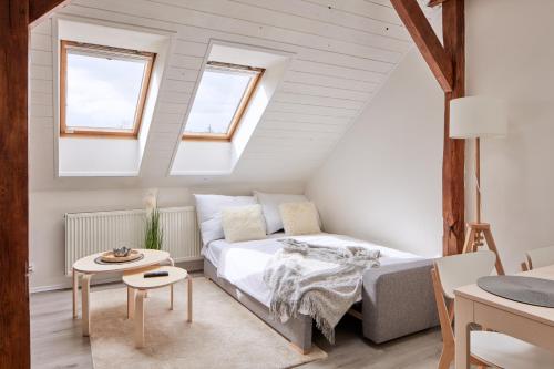 Un pat sau paturi într-o cameră la Cozy Attic Flat in Michle by Prague Days