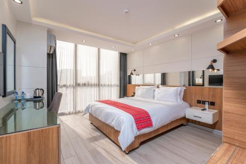 Giường trong phòng chung tại MAA Hotel and Suites - Hurlingham, Nairobi