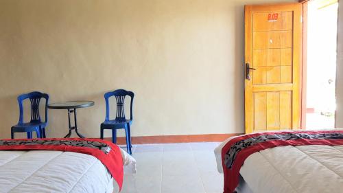 Postel nebo postele na pokoji v ubytování Villa Alam Flores Mbohang Ruteng Mitra RedDoorz