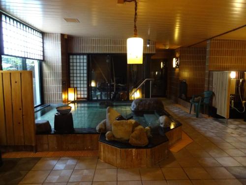 a lobby with a couch with teddy bears on it at Dormy Inn Hakata Gion in Fukuoka