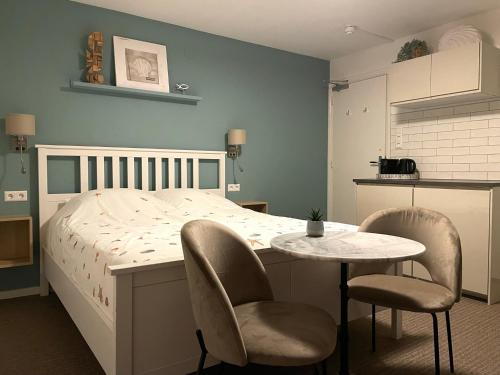 Ein Bett oder Betten in einem Zimmer der Unterkunft Divi Divi Zandvoort
