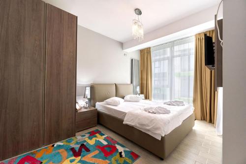 Voodi või voodid majutusasutuse Olive apartment in Spa n Pool Resort-parking toas