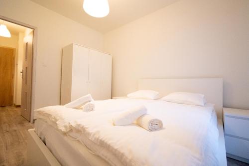 Posteľ alebo postele v izbe v ubytovaní Apartament Charlie
