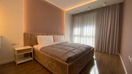 Katil atau katil-katil dalam bilik di Tirana Primo Apartment