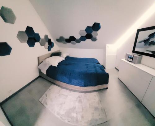 Katil atau katil-katil dalam bilik di Apartament POD STRZECHĄ
