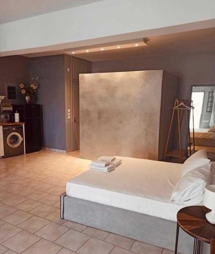 a bedroom with a large bed in a room at Ambrosia in Tinos