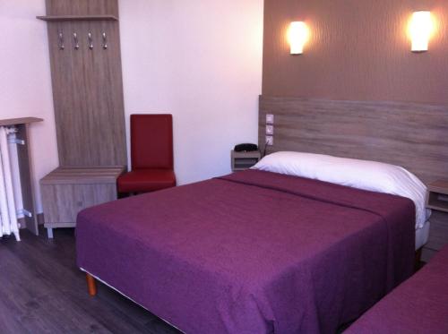 Tempat tidur dalam kamar di Grand Hôtel Magenta