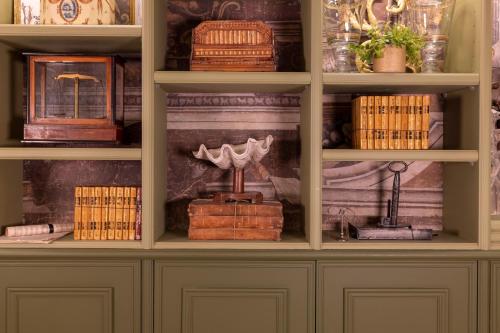 a book shelf filled with lots of books at Maison Cardinal Furstemberg in Paris