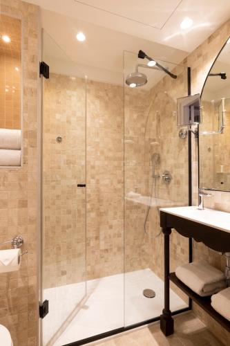 a bathroom with a shower and a sink at Maison Cardinal Furstemberg in Paris