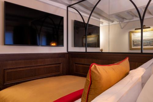 a seat in the back of a boat at Maison Cardinal Furstemberg in Paris