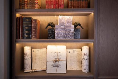 a book shelf filled with lots of books at Maison Cardinal Furstemberg in Paris