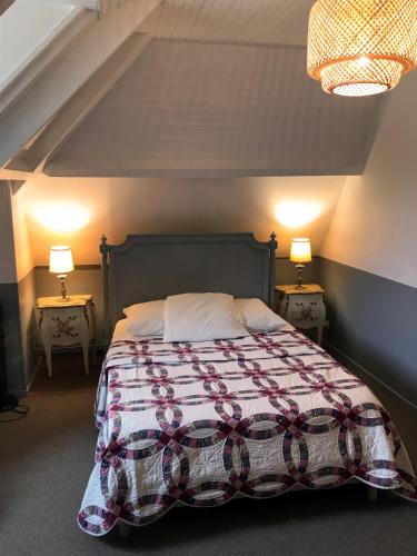 Кровать или кровати в номере Le Petit Giverny