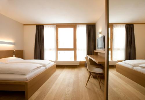 Postel nebo postele na pokoji v ubytování Hotel Manggei Designhotel Obertauern