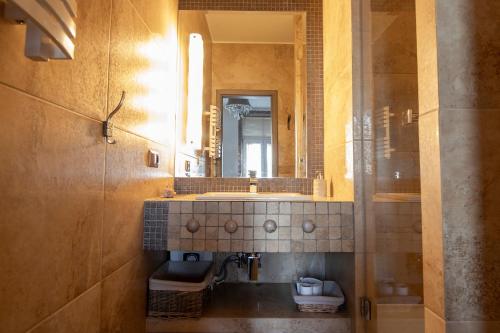 a bathroom with a sink and a mirror at Apartamenty Gdynia City Center in Gdynia