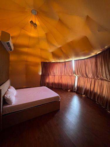a room with a bed in a tent at ببالز Ajloun عش وسط الطبيعة - ِAjloun Bubbles Live amid nature in Ajloun