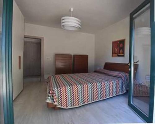 Postel nebo postele na pokoji v ubytování Casa Polinisso