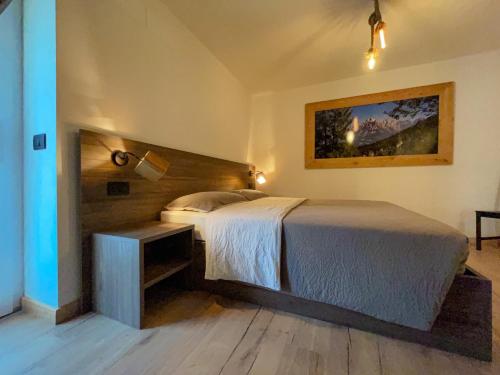 En eller flere senger på et rom på Alpenrooms