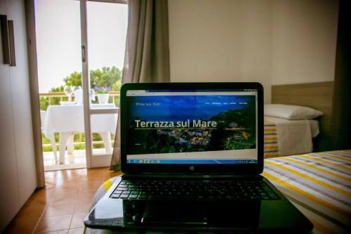 a laptop computer sitting on a table in a room at Primo Sole in Cupra Marittima