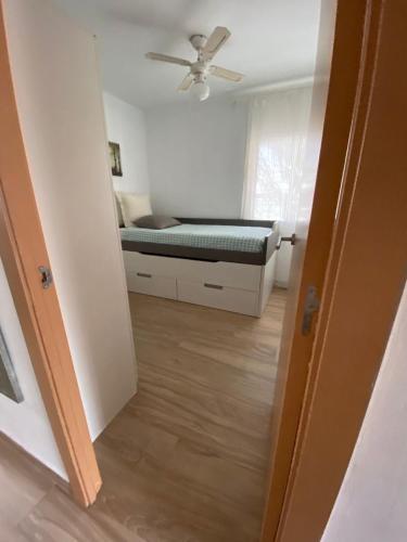 a bedroom with a bed and a ceiling fan at Appartement ALFONSO in Salou