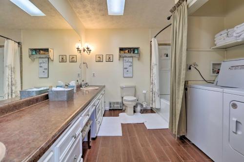 a bathroom with a sink and a toilet at Charming East Bernstadt Retreat Less Than 6 Acre Farm! in East Bernstadt