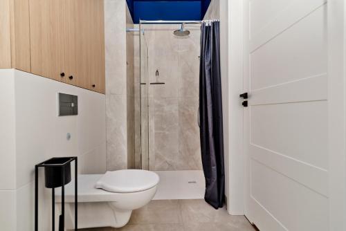 Koupelna v ubytování BlueApart Apartamenty Hotelowe Nexo