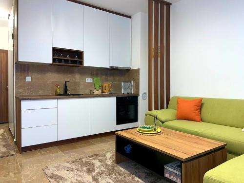 a living room with a couch and a table at Apartment Aria in Travnik