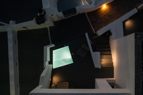 a view from above of a room with a television at Smaro Studios in Firostefani