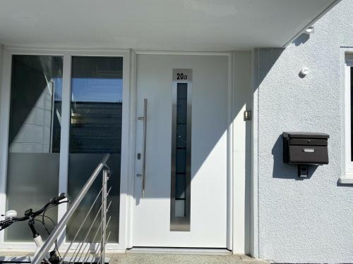 a door of a building with a mailbox next to it at Schöne Lemgoer Unterkunft in Lemgo