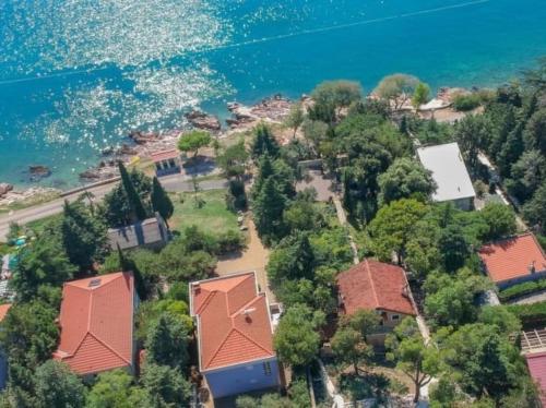 an aerial view of a house next to the water at Novi Escape 2 Beachfront 4 Star Apartment in Novi Vinodolski