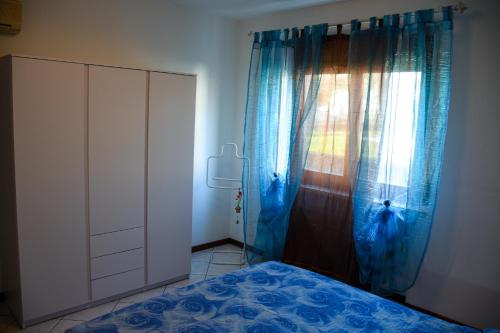 Ένα ή περισσότερα κρεβάτια σε δωμάτιο στο Casa Rosetta