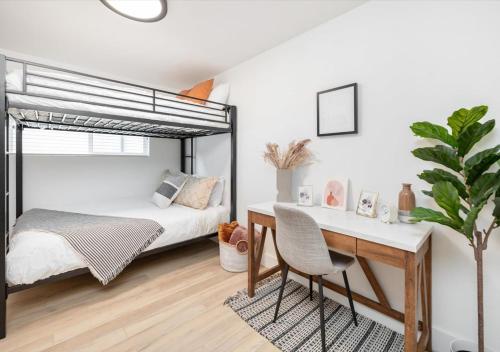 a bedroom with a bed and a desk at Mid Century Modern Boise-River Bungalow w/ Hot Tub in Boise