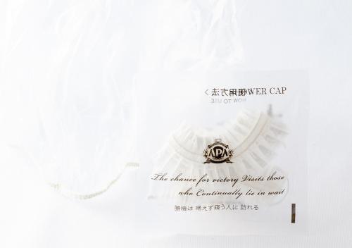 a white envelope with a certificate with a ring at APA Hotel Asakusa Kaminarimon Minami in Tokyo