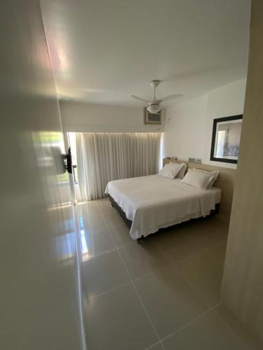 Ένα ή περισσότερα κρεβάτια σε δωμάτιο στο Apart Hotel em Ondina