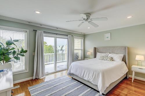a bedroom with a bed and a balcony at Turtle Bay 5 in Folly Beach