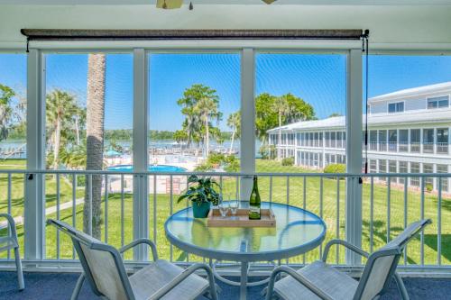 a balcony with a table and chairs and a view of the ocean at River Bend B212 in Welaka