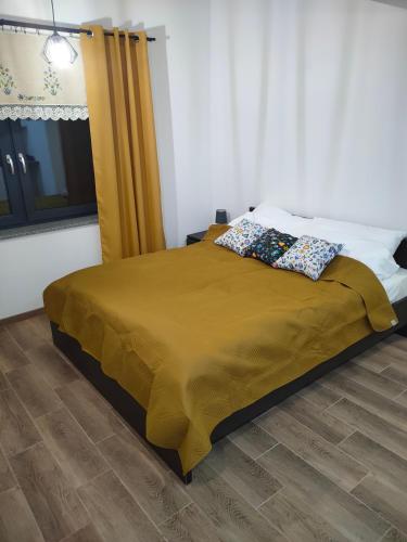 A bed or beds in a room at Kaszubski Zakątek Brodnica Górna