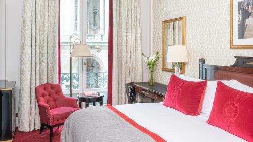 a bedroom with a bed and a desk and a chair at InterContinental Paris Le Grand by IHG in Paris