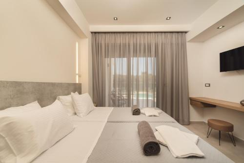 מיטה או מיטות בחדר ב-Villa De Reve