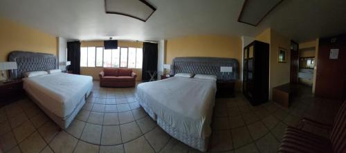 Cama o camas de una habitación en el Hotel el Cortes