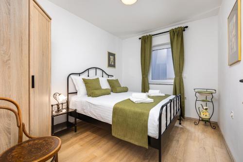 Katil atau katil-katil dalam bilik di Bonihome Apartments