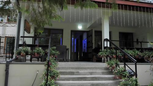a house with stairs leading to the front door at DUKAT in Horyniec Zdrój