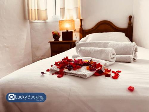 Ένα ή περισσότερα κρεβάτια σε δωμάτιο στο ZAHARA LUCKY BOOKING