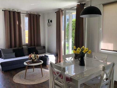 a living room with a table and a couch at Apartments Zafira in Ohrid