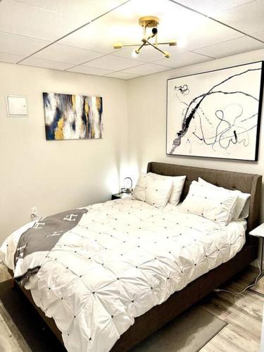a bedroom with a large bed in a room at Luxury and cozy 1 Bed Condo in the heart of Providence in Providence